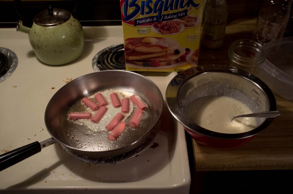 start with some vienna sausages and make some bisquick. narrowly averted disaster when i started to crack the egg into the pan instead of the pancake mix