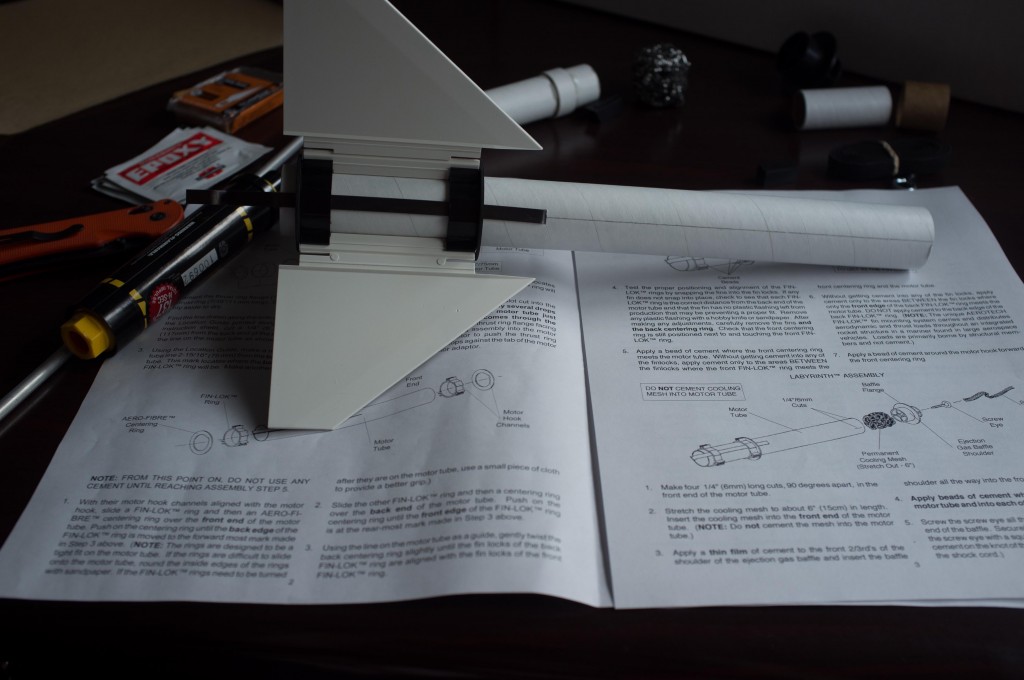 Checking the fin mounts for proper alignment. The fins, which mount through the body, transfer the motor's impulse from the motor mount to the rocket's body. Cool, huh?